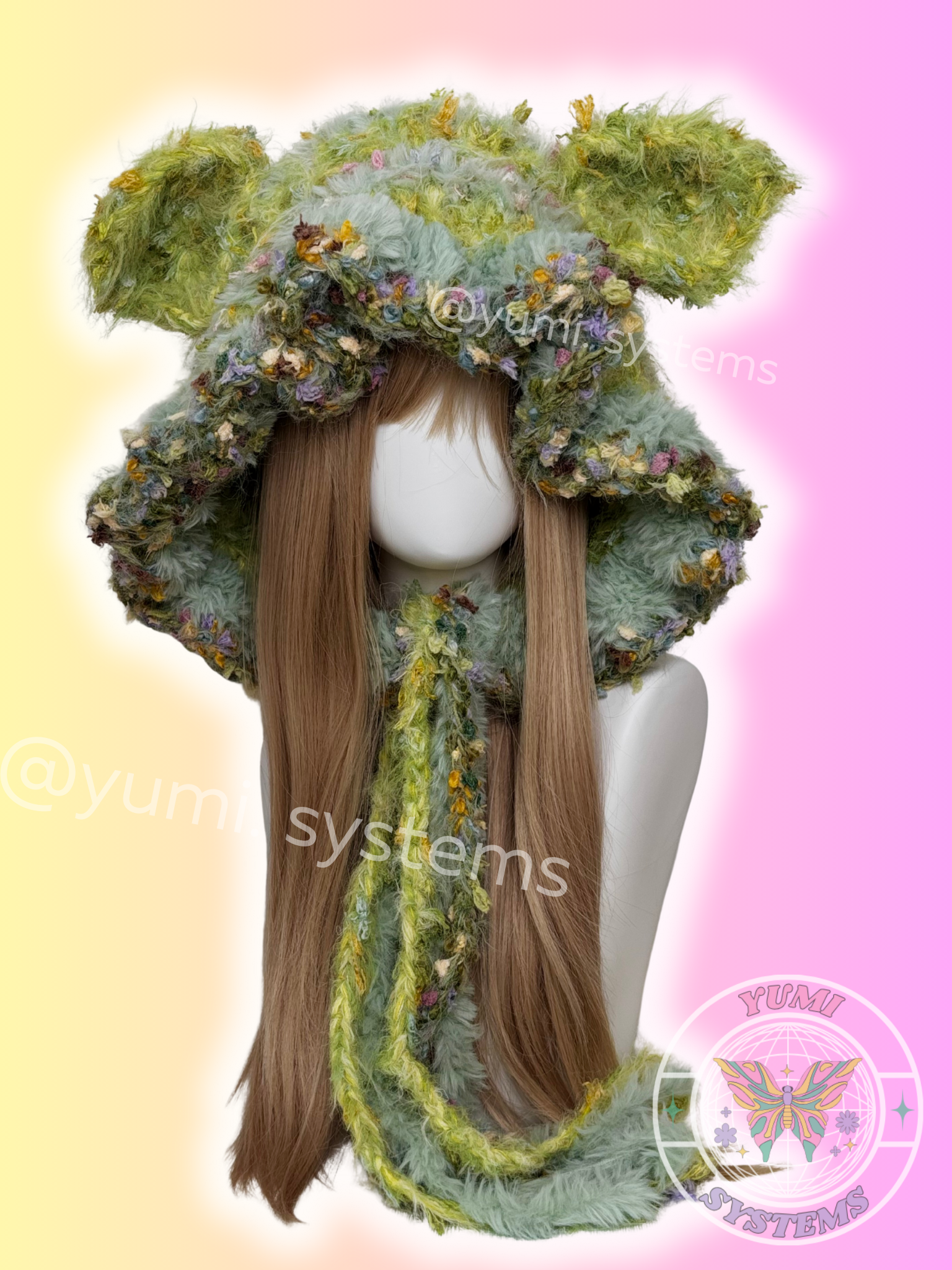  High-density handmade fuzzy cat and bunny ear modular aviator beanies in various multi-tonal colorways on a mannequin.